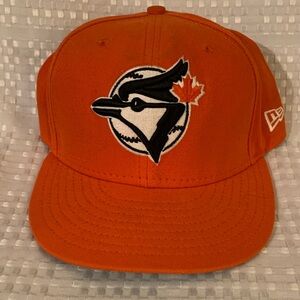 New Era 59Fifty orange Toronto Blue Jays cap, size 7 and 1/8.
